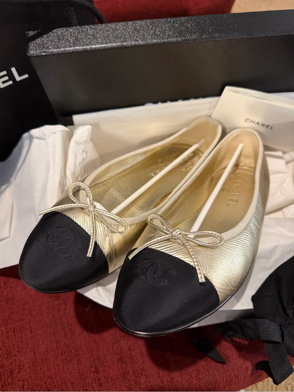 CHANEL Gold Leather Ballet Flats with Black Cap Toe Winter 2025 Season